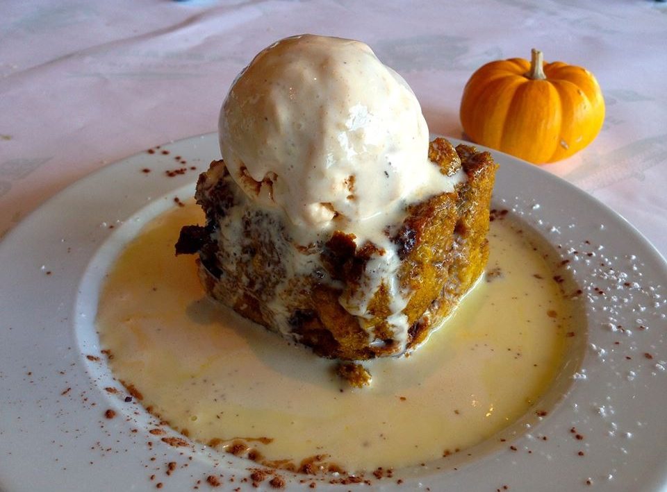 Pumpkin bread pudding with melting vanilla ice cream
