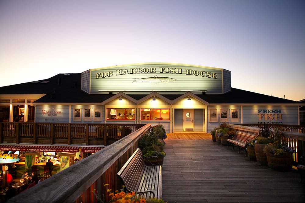 The front of Fog Harbor Fish House at night