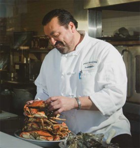 chef adolfo soto preparing dungeness crabs in the kitchen