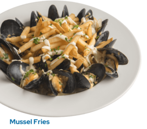 Mussels, onions, fennel, sambuca cream, garlic aioli on a plate with the caption Mussel Fries