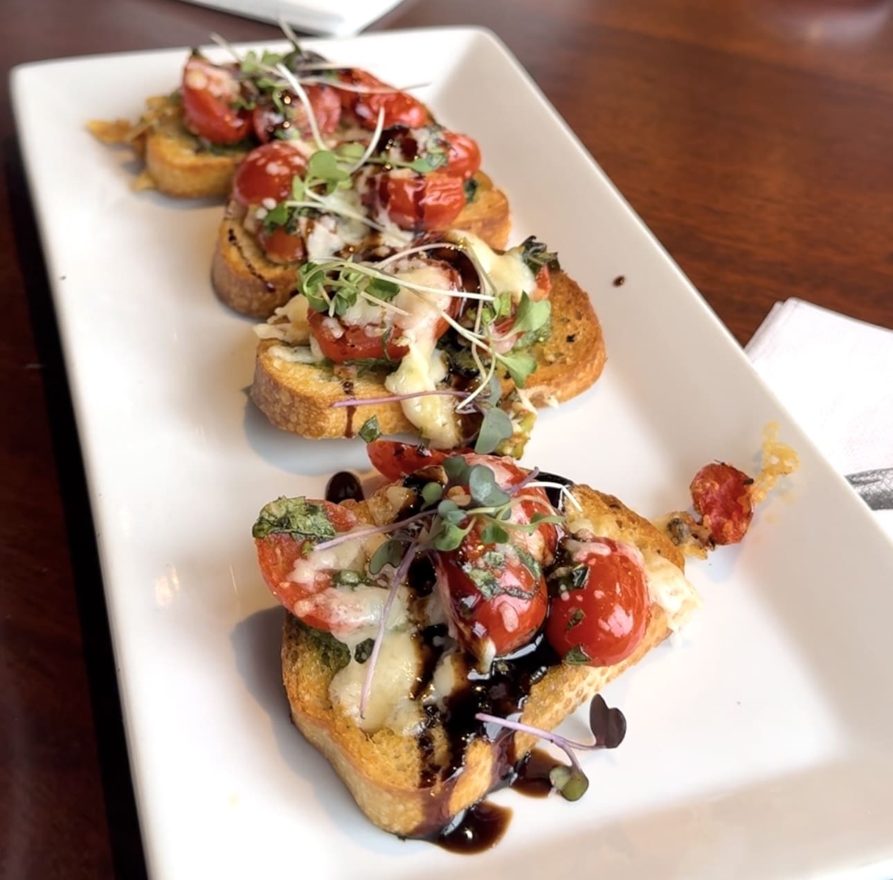 Plate of baked crab and tomato bruschetta