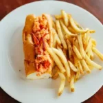 Lobster roll and fries on a plate