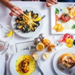 People eating seafood at a dining table