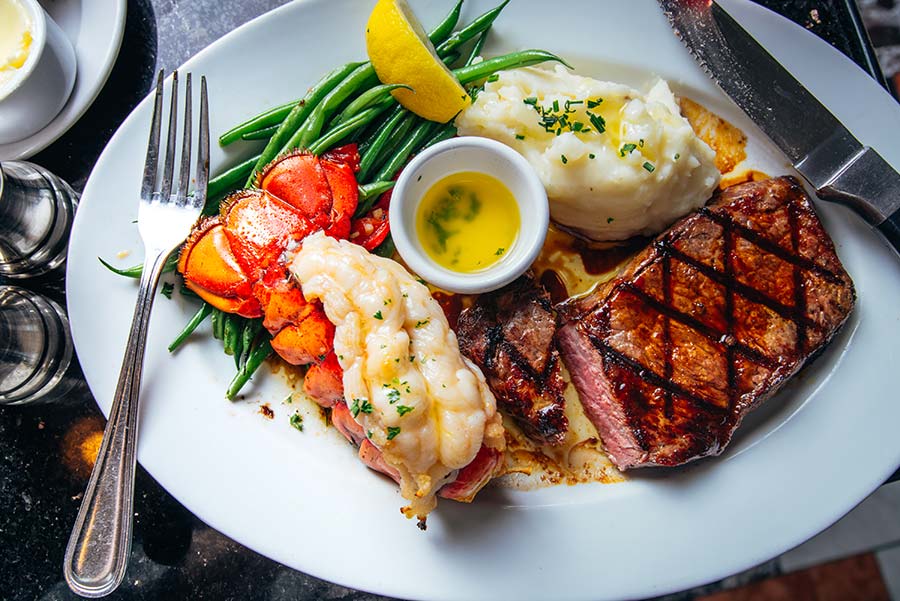 Surf and turf dish with fork and knife