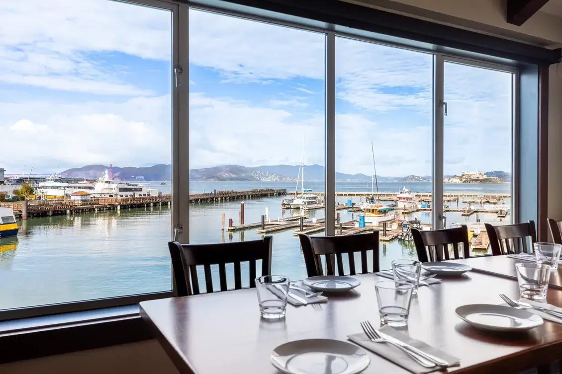 View of boats docked in the San Francisco Bay from a private dining room.